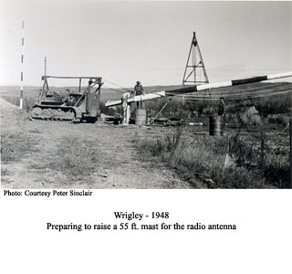 Raising antenna mast, Wrigley 1948